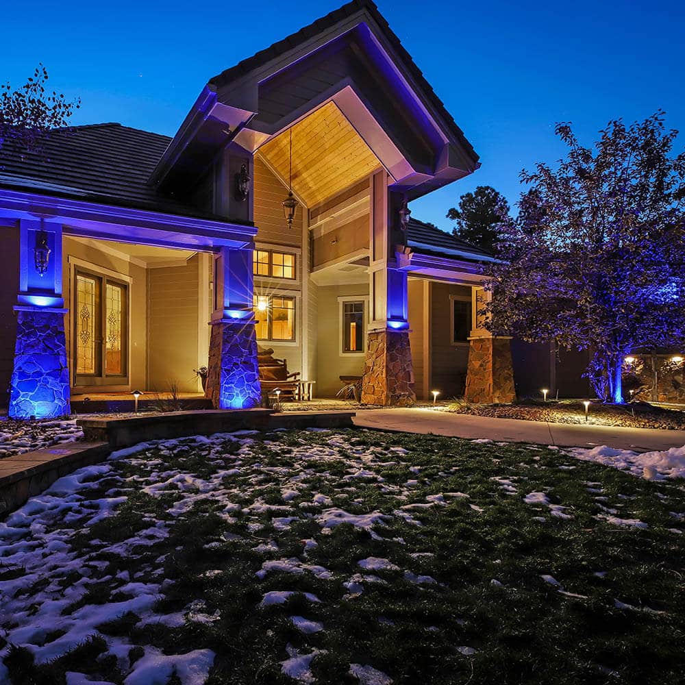 A house facade lit by DEKOR® puck lights. 