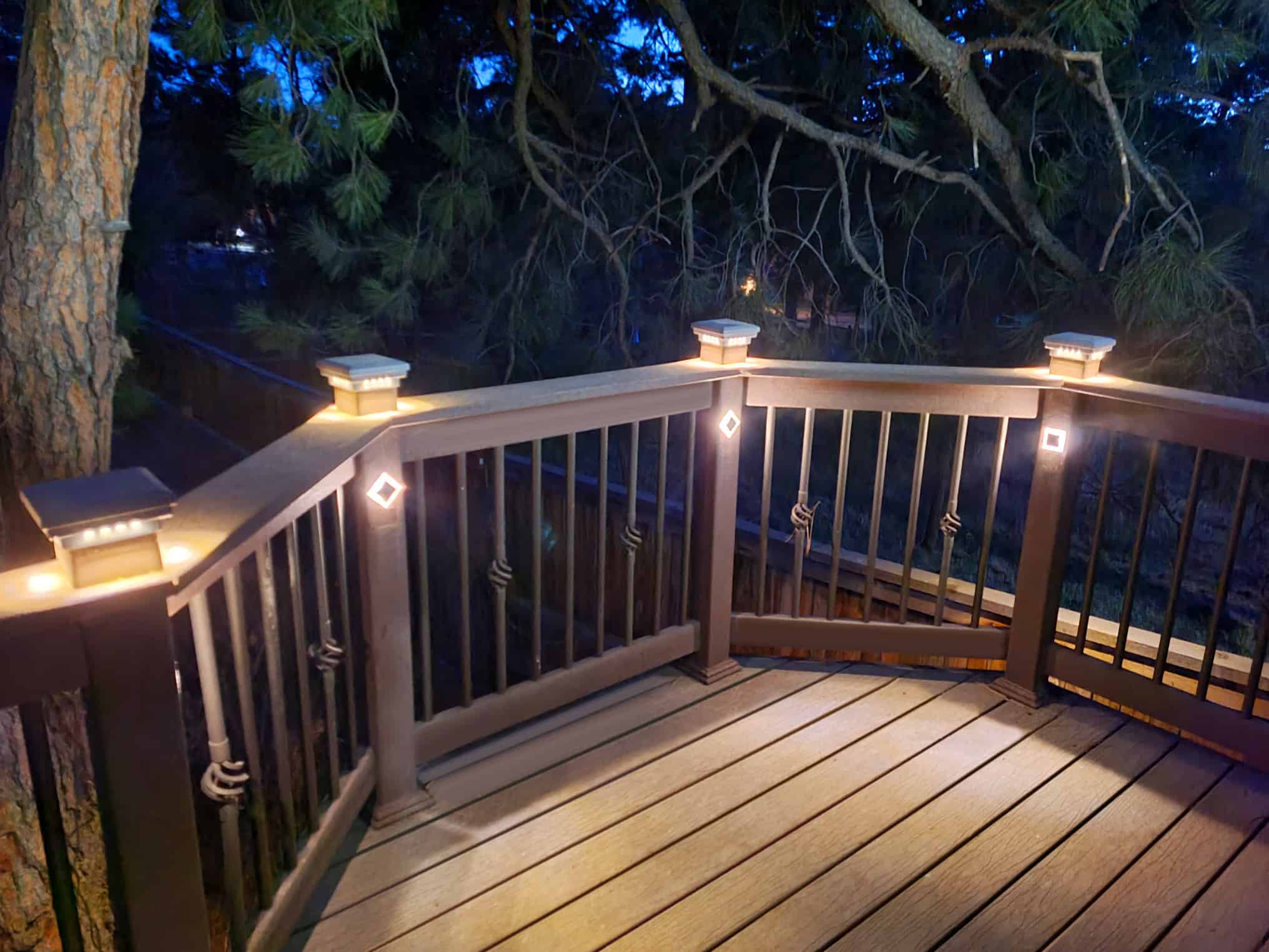 Wooden deck with diamond shaped accent rail lights.