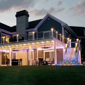 Colored LED Recessed Lights from DEKOR® decorating a two-level deck with stairs