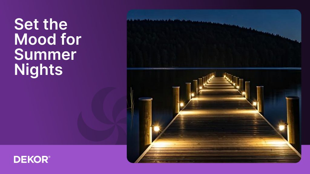 Wooden dock illuminated with warm DEKOR® LED post lights extending over a calm lake at night, with the text “Set the Mood for Summer Nights” on a purple background.