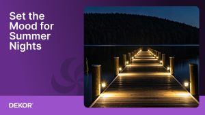 Wooden dock illuminated with warm DEKOR® LED post lights extending over a calm lake at night, with the text “Set the Mood for Summer Nights” on a purple background.
